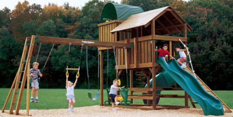 wooden playhouse and swing set