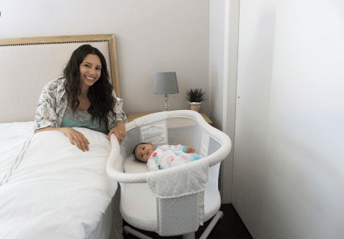 bassinet next to bed